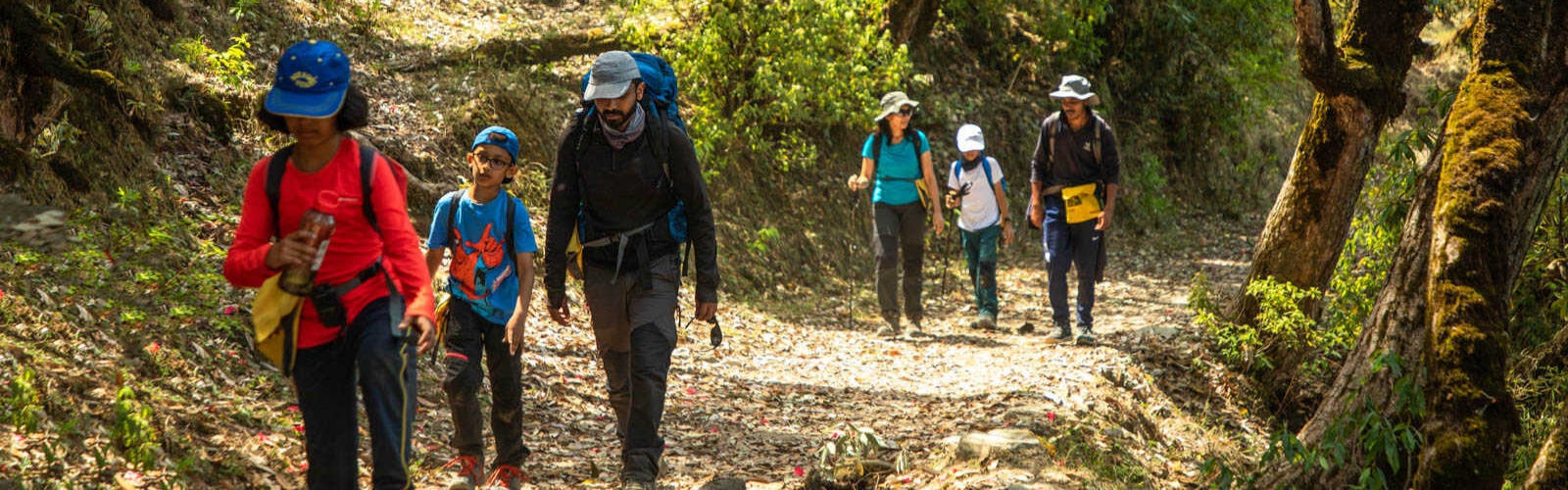 Family enjoying trekking adventure in scenic mountains together