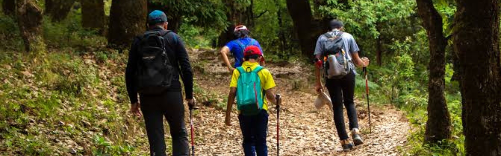 Happy family exploring mountain views during trek
